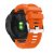 Garmin Fenix 7X Pro med pulsmätare och orange sportarmband – vy bakifrån